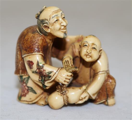 A Japanese ivory polychrome decorated netsuke, first half 20th century, height 4cm